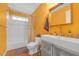 Bright bathroom with tiled shower, modern vanity, and warm yellow walls at 730 Brownwood Se Ave, Atlanta, GA 30316