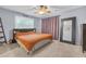 Bedroom featuring a bed, a large mirror, and a window with natural light at 730 Brownwood Se Ave, Atlanta, GA 30316