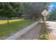 Street view of a home with a landscaped front yard, retaining wall, and sidewalk at 730 Brownwood Se Ave, Atlanta, GA 30316