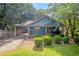 Charming blue home with a welcoming front porch, covered parking, and a well-manicured lawn at 730 Brownwood Se Ave, Atlanta, GA 30316