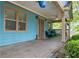 Inviting covered front porch with comfortable seating, ceiling fan, and decorative hanging plants at 730 Brownwood Se Ave, Atlanta, GA 30316