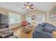 Bright living room with vaulted ceiling, wood floors, and plenty of natural light from large windows at 730 Brownwood Se Ave, Atlanta, GA 30316
