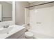 Bathroom featuring a shower and tub combo with white tiling and white vanity at 924 Sweetwater Cir, Lawrenceville, GA 30044