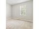 The bedroom features neutral paint, carpet flooring, and a window at 924 Sweetwater Cir, Lawrenceville, GA 30044