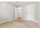 A simplistic bedroom offers two door access and neutral color schemes at 924 Sweetwater Cir, Lawrenceville, GA 30044