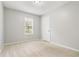The bedroom features neutral paint, carpet flooring, and a window at 924 Sweetwater Cir, Lawrenceville, GA 30044