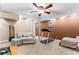 Finished basement featuring carpet, a treadmill, seating area, and a television at 119 Castlewood Rd, Tyrone, GA 30290
