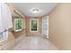 Bright bathroom boasts tiled floors, vanity, and large windows with serene views at 119 Castlewood Rd, Tyrone, GA 30290