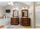Double vanities with dark wood cabinets in this charming bathroom at 119 Castlewood Rd, Tyrone, GA 30290