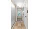 Bright bathroom featuring a shower, window with blinds, and tile flooring at 119 Castlewood Rd, Tyrone, GA 30290