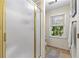 Bright bathroom featuring a shower, window with blinds, and tile flooring at 119 Castlewood Rd, Tyrone, GA 30290