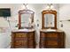 Dual vanities with classic framed mirrors offering ample countertop space at 119 Castlewood Rd, Tyrone, GA 30290