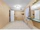 Spacious bathroom features tile flooring, large mirror, and natural light at 119 Castlewood Rd, Tyrone, GA 30290
