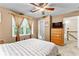 Bedroom with carpet, neutral walls, and a ceiling fan, along with dresser and television at 119 Castlewood Rd, Tyrone, GA 30290