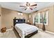 Bedroom with neutral walls, carpet, a ceiling fan, and a bed with storage underneath at 119 Castlewood Rd, Tyrone, GA 30290