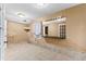 Large bonus room featuring tile floors and a large mirror at 119 Castlewood Rd, Tyrone, GA 30290