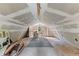 Spacious unfinished bonus room with natural light and sloped ceilings at 119 Castlewood Rd, Tyrone, GA 30290