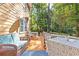 Outdoor deck features comfortable seating, lighting, and a private setting at 119 Castlewood Rd, Tyrone, GA 30290