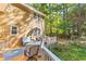 Enjoy outdoor living on this spacious deck with dining and lounge seating at 119 Castlewood Rd, Tyrone, GA 30290