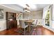 Inviting dining room with hardwood floors, wainscoting, neutral color palette, and natural light at 119 Castlewood Rd, Tyrone, GA 30290