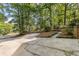 Long driveway and parking area surrounded by mature trees at 119 Castlewood Rd, Tyrone, GA 30290