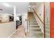 Bright entryway with tile flooring, staircase, and view to living room at 119 Castlewood Rd, Tyrone, GA 30290