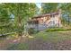 Charming house nestled among mature trees, featuring a spacious deck perfect for outdoor entertaining at 119 Castlewood Rd, Tyrone, GA 30290