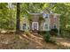 Charming two-story home with brick and siding exterior and beautiful mature trees at 119 Castlewood Rd, Tyrone, GA 30290