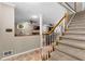 Home foyer with staircase leads to an open living area with fireplace and mantel at 119 Castlewood Rd, Tyrone, GA 30290