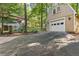 Exterior shot of the detached garage with ample parking space and a bonus room at 119 Castlewood Rd, Tyrone, GA 30290