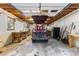 Interior of detached garage with a golf cart, workspace, and ample storage at 119 Castlewood Rd, Tyrone, GA 30290