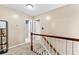 Upstairs hallway with carpet, neutral paint and view of bathroom at 119 Castlewood Rd, Tyrone, GA 30290