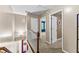 Hallway area showcasing a carpeted floor, white doors and staircase at 119 Castlewood Rd, Tyrone, GA 30290