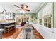 Eat-in kitchen with hardwood floors leads to a sunny, window-filled living area at 119 Castlewood Rd, Tyrone, GA 30290