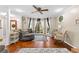 Inviting living room with hardwood floors, natural light from bay window, and neutral color palette at 119 Castlewood Rd, Tyrone, GA 30290
