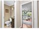 A powder room connects to a kitchen and breakfast area, showcasing functionality at 119 Castlewood Rd, Tyrone, GA 30290