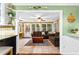 Bright and airy sunroom with ample windows and tile flooring with casual seating at 119 Castlewood Rd, Tyrone, GA 30290