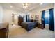 This primary bedroom features a trey ceiling, neutral carpet, and large windows at 175 Robin Ct, Fayetteville, GA 30215