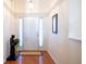 Bright foyer with hardwood floors, white trim, and a view of the front door at 175 Robin Ct, Fayetteville, GA 30215