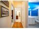A hallway featuring beautiful hardwood floors and access to the bathroom and bedroom at 175 Robin Ct, Fayetteville, GA 30215