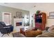 Cozy living room with a marble fireplace, vaulted ceiling, and comfortable seating at 175 Robin Ct, Fayetteville, GA 30215