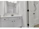 Bright bathroom features a white vanity and a shower with a tub at 3320 Pleasant Springs Dr, Cumming, GA 30028