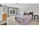 Cozy bedroom with a large window and neutral decor at 3320 Pleasant Springs Dr, Cumming, GA 30028