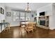 Sunlit breakfast nook with fireplace and backyard views at 3320 Pleasant Springs Dr, Cumming, GA 30028