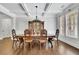 Dining room with hardwood floors, coffered ceilings, and a large window at 3320 Pleasant Springs Dr, Cumming, GA 30028