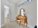 Hallway features vanity table, neutral carpet, and an abundance of natural light at 3320 Pleasant Springs Dr, Cumming, GA 30028