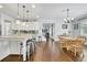 Kitchen features granite counters, stainless steel appliances, a kitchen island with bar seating and an adjacent breakfast nook at 3320 Pleasant Springs Dr, Cumming, GA 30028
