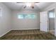 Neutral bedroom features carpet flooring, neutral walls, a ceiling fan, and a bright window at 3409 Hyland Dr, Decatur, GA 30032