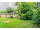 Residential property with an ample front lawn and mature trees offering shade and privacy at 3409 Hyland Dr, Decatur, GA 30032
