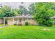 Charming single-story home with a covered front porch and a green lawn, perfect for outdoor enjoyment at 3409 Hyland Dr, Decatur, GA 30032